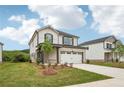 Beautiful two-story home boasts a manicured lawn, two-car garage, and inviting curb appeal at 4830 Marjorie Dr, Cumming, GA 30041