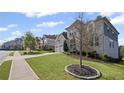 Beautiful home featuring a well-manicured front yard with an ample lawn and mature trees at 5153 Elkins Ln, Acworth, GA 30101