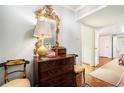 Entry foyer featuring hardwood floors, decorative mirror, and a charming antique chest at 2769 Peachtree Ne Rd # 6, Atlanta, GA 30305