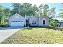 Charming one-story home with a two car garage and well-maintained landscaping at 4640 Lambton Cir, Suwanee, GA 30024