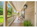 Relaxing front porch with rocking chairs offering a serene outdoor space at 925 Upper Hembree Rd, Roswell, GA 30076
