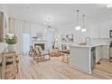 Sun-drenched living area featuring sleek hardwood floors and a cozy fireplace at 1971 Sterling Oaks Cir, Brookhaven, GA 30319