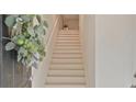 Bright foyer showcasing new staircase with a decorative wreath on front door at 1971 Sterling Oaks Cir, Brookhaven, GA 30319