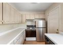 Efficient kitchen with gas range, stainless refrigerator, and lots of cabinets for your convenience at 4282 Roswell Ne Rd # C3, Atlanta, GA 30342