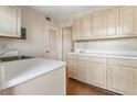 Functional kitchen with wood-look floors, pantry, and ample cabinets for all your storage needs at 4282 Roswell Ne Rd # C3, Atlanta, GA 30342