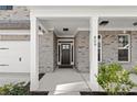 Inviting front entrance with a covered porch and brick facade at 809 Kirby Dr, Woodstock, GA 30188