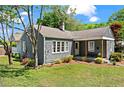 Charming home featuring classic architecture, a cozy porch, and a well-maintained front yard at 756 Ormewood Se Ave, Atlanta, GA 30312