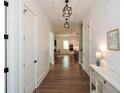 Open-concept hallway with views into the living room and kitchen, showcasing the home's layout at 2235 Birchtree Way, Marietta, GA 30062