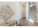 Elegant entryway featuring hardwood floors, modern decor, and staircase at 1300 Memorial Se Dr # 12, Atlanta, GA 30317