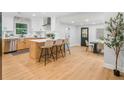 Bright, open kitchen featuring a central island, stainless steel appliances, and sleek white cabinetry at 2781 Long Way, Decatur, GA 30032