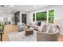 Cozy living room showcasing neutral tones, plush seating, and ample natural light at 2781 Long Way, Decatur, GA 30032
