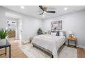 Comfortable bedroom features a neutral color palette, ceiling fan and hardwood floors at 2781 Long Way, Decatur, GA 30032
