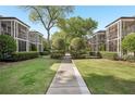 Beautifully landscaped exterior with manicured lawns and mature trees at 55 Delmont Ne Dr # D1, Atlanta, GA 30305