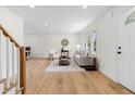 Open concept living room with hardwood floors, neutral decor, and ample natural light at 3107 Park Ln, Snellville, GA 30078