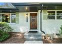 Close-up of the beautiful front door with stylish hardware and the house number prominently displayed at 3200 Rehoboth Dr, Decatur, GA 30033