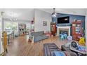 Spacious living room with hardwood floors, fireplace, and ample seating at 111 Amberwood Ln, Euharlee, GA 30145