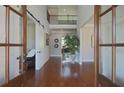 Elegant two-story foyer with hardwood floors and open access to the home's interior at 2331 Kinsale Nw Pt, Kennesaw, GA 30152