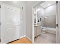Bathroom with neutral tile, granite vanity, framed art, and a shower and tub combo at 44 Peachtree Nw Pl # 528, Atlanta, GA 30309