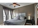 Cozy bedroom featuring a comfortable bed, soft lighting, and views of the city at 195 14Th St # 1403, Atlanta, GA 30309
