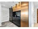 Sleek kitchen design with black and gold cabinets, and stainless-steel appliances at 250 Pharr Ne Rd # 1113, Atlanta, GA 30305