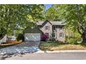 Charming two-story home with a well-manicured lawn, lush landscaping and a two-car garage at 4095 Fastnet Ln, Duluth, GA 30096