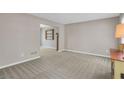 Spacious living room with neutral carpeting and paint, ready for your personal touch at 4095 Fastnet Ln, Duluth, GA 30096
