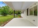 View of the spacious porch with string lights and a comfortable, covered seating area for relaxing outdoors at 1217 Topaz Ln, Villa Rica, GA 30180