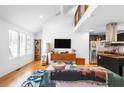 Bright living room featuring hardwood floors, modern furnishings, and a stylish open floor plan, with vaulted ceilings at 1952 Don Juan Ln, Decatur, GA 30032