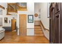Welcoming foyer features hardwood floors and stairs leading to the second floor at 440 Hunt River Way, Suwanee, GA 30024