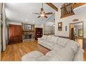 Spacious living room features hardwood floors, stone fireplace, and vaulted ceiling at 440 Hunt River Way, Suwanee, GA 30024