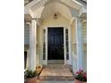 Front door with decorative plants and stone walkway at 2180 Ridge Rd, Canton, GA 30114