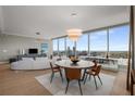 Elegant dining room with a modern chandelier and expansive city view windows at 3630 Peachtree Ne Rd # 3207, Atlanta, GA 30326
