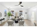 Bright living room with hardwood floors, neutral decor, and large windows offering great natural light at 907 Oakhill Sw Ave, Atlanta, GA 30310