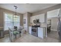 Bright eat-in kitchen boasts stainless steel appliances and ample cabinet space at 2186 Mainsail Dr, Marietta, GA 30062