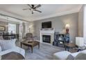Inviting living room featuring a fireplace, hardwood floors, and lots of natural light at 2186 Mainsail Dr, Marietta, GA 30062