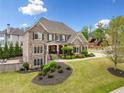 Attractive brick home with well-kept lawn, offering a blend of comfort and sophistication at 903 Shaftoe Nw St, Kennesaw, GA 30152