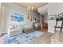 Inviting living room with a plush sofa, area rug, entertainment center, and modern decor at 943 Peachtree Ne St # 2002, Atlanta, GA 30309