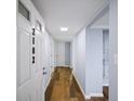 Light and airy hallway with hardwood floors and neutral walls at 2102 Palmyra Se Dr, Marietta, GA 30067