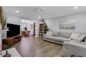 Inviting living room featuring hardwood floors, modern decor, and a comfortable sofa at 4128 Boxwood Way, Duluth, GA 30096