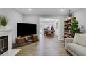 Spacious living area with hardwood floors and seamless flow to dining space at 4128 Boxwood Way, Duluth, GA 30096