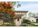 Charming home showcasing classic architecture, complemented by mature landscaping and a welcoming entrance at 286 Norwood Ne Ave, Atlanta, GA 30317