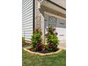 Decorative planters filled with flowers and greenery adorn the exterior of the home at 4188 Fawn Ivy Ln, Marietta, GA 30064