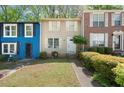 Inviting townhouse with a green lawn and pathway leading to the front door at 1784 Timber Valley Se Way, Smyrna, GA 30080
