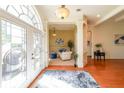 Bright foyer features hardwood floors, elegant columns, and a decorative front door at 3230 Letha Woods Dr, Conyers, GA 30094