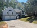 Charming home with two-car garage, front stairs, and stone accents at 3861 Spring Meadow Dr, Acworth, GA 30101