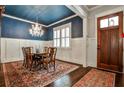 Elegant dining room with a chandelier and a blue ceiling at 144 Park Dr, Decatur, GA 30030