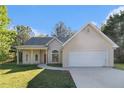 Charming single-story home with well-manicured lawn and attached two-car garage at 2505 Rockmart Rd, Villa Rica, GA 30180