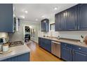 Modern kitchen with navy cabinets, stainless steel appliances, and ample counter space at 1195 Oglethorpe Ne Ave, Atlanta, GA 30319