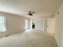 Spacious bedroom with neutral carpet, ceiling fan, and access to ensuite bathroom and large closet at 3312 Winter Wood Ct, Marietta, GA 30062