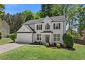Stunning, well-maintained two story home with a manicured lawn and attached two car garage at 4680 Glen Level Dr, Sugar Hill, GA 30518
